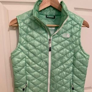 The North Face vest in green.